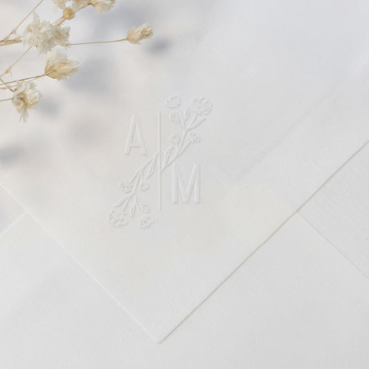 Dry stamp with floral initials