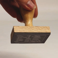 Ex-libris stamp, well-stocked shelf