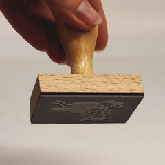 Ex-libris stamp of a woman carrying books