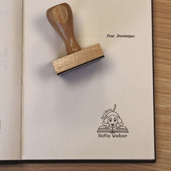 Bookplate of a dog on a book
