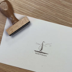 Ex-libris stamp of a small sailboat