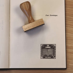 Ex-libris stamp, white book on black