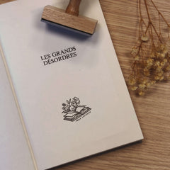 Ex-libris stamp depicting vegetation emerging from the book