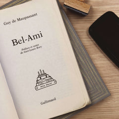 Ex-libris stamp, books, cake