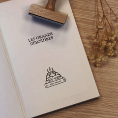 Ex-libris stamp, books, cake