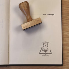 Ex-libris stamp with cat on book